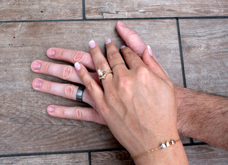 Newly married couple showing their beautiful rings designed by bride. Downers Grove Illinois IL USA