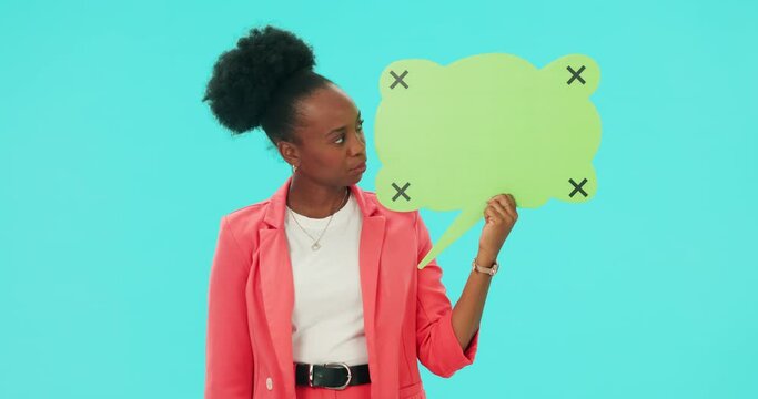 African woman, speech bubble poster and studio with thumbs down, bad review or vote by blue background. Girl, student and mockup space for social media, opinion or negative feedback with serious face