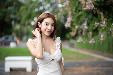 Young woman standing with beautiful nature.