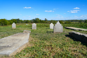 Old gravestones on a grassy hilltop