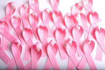 Pink colored ribbon isolated on White background. Symbol of breast cancer awareness. healthcare and...