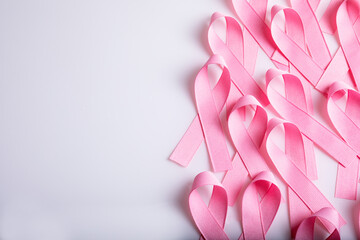 Pink colored ribbon isolated on white background. Symbol of breast cancer awareness. healthcare and...
