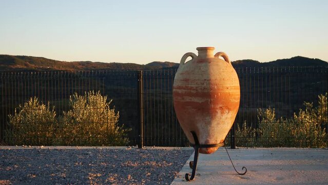 Clay jug for winemaking at sunset. Autumn evening near city Vrh and Lake Butoniga. Inner Istria. Tourist places. Beautiful natural environment of Istrian peninsula. Istria, Croatia - November 25, 2023