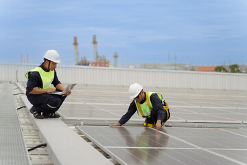 Technology solar cell, Engineers walking on roof inspect and check solar cell panel, service check installation solar cell on the roof of factory, repair solar cell on the roof of factory.