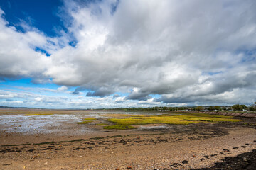 clouds over the bay at low tide