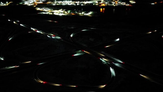 Drone timelapse of a busy highway interchange during rush hour