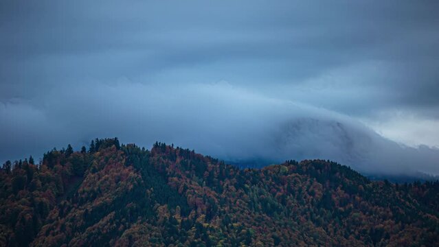 Low clouds over the mountains in Austria in autumn - time lapse