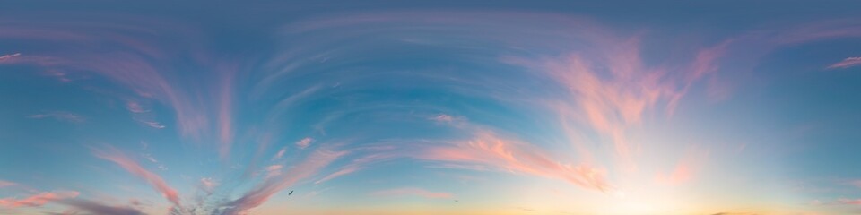 Sunset sky panorama, glowing pink Cirrus clouds, seamless 360 hdr equirectangular, great for virtual reality projects and sky replacement.