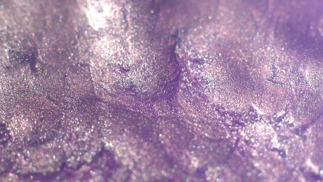 Magic shine pink and lilac colors fluid Ink. Christmas background. Silver shiny particles form a beautiful bokeh