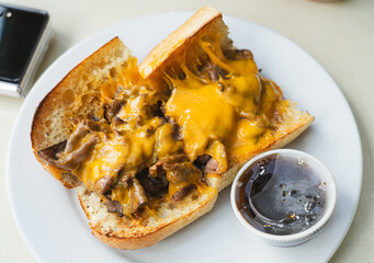 Cheesesteak, top down view, with sauce