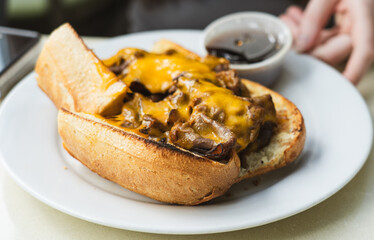 Cheesesteak sub with sauce