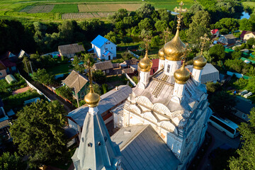 Gilded domes with crosses on an ancient Orthodox church. Spaso-Preobrazhensky Church of the 17th...