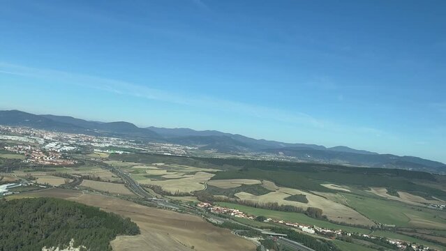 Aerial panoramic view of Pamplona city, in Spain, aS seen by the pilots in a real time flight, in a sunny bright morning