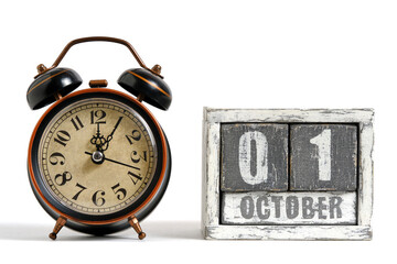 October 01 on wooden calendar with alarm clock white background.