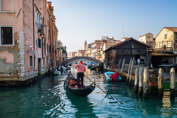 Fototapeta na wymiar A gondolier working in Venice