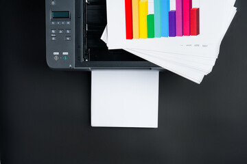 Modern laser printer on black background close up