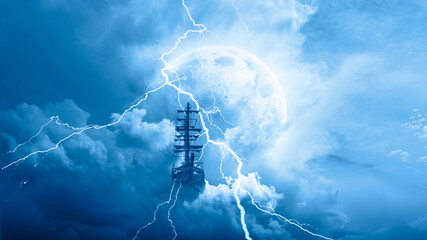 Flying old ship in the stormy dark clouds with full moon 