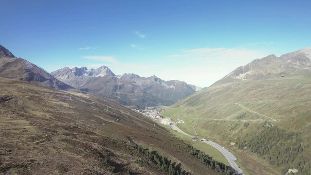 Aerial small town K&uuml;htai, Austria within beautiful calming mountain alps summer sunny landscape
