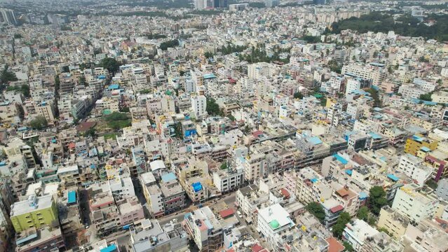 Bengaluru, the capital of Karnataka, is depicted in dramatic aerial footage as a busy residential neighbourhood encircled by single-family homes and apartment buildings.