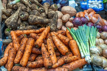 Carrots, parsnip and other vegetables for sale at a market