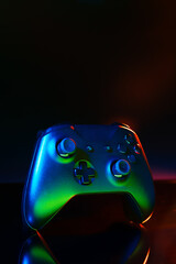 Gaming joystick on black background in neon light © fotofabrika