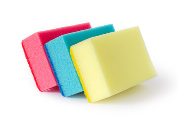 Foam sponges for washing dishes on a white background. Three multi-colored foam sponges.