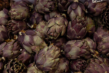 close up of some artichoke in brown and purple color