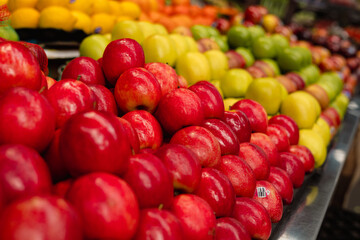 lemon, red and green apples on the market, fruit and vegetable corner in supermarket