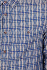 material sample of a stylish men's shirt made of denim material on a white background