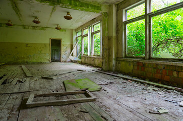 Premises of abandoned school in resettled village of Pogonnoe in exclusion zone of Chernobyl nuclear power plant, Belarus