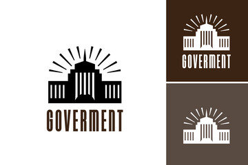 "Government building with sunburst logo design" is a graphic illustration of a government facility with a sunburst logo. It's suitable for official use, government publications, and branding materials