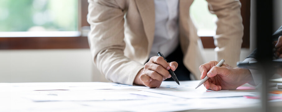 Businessman advisor, business people talking, planning analyze investment and marketing on tablet in office..