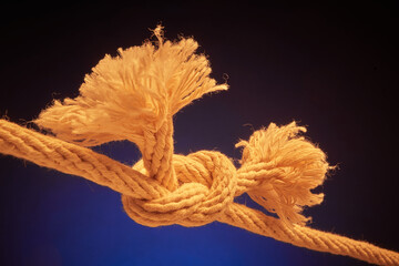 Ends of frayed rope tied together