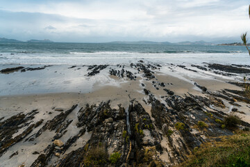 Rocky formation and white sand beach, Playa de Patos