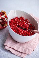 Ripe seeds of pomegranate fruit in the bowl