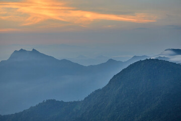 Obraz premium Dramatic sky with morning fog in mountain
