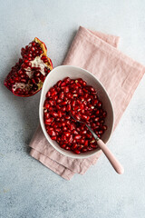 Ripe seeds of pomegranate fruit in the bowl