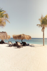 Empty beach hut with chairs at sandy beach of Gili Islands