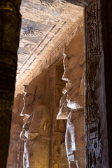Hieroglyphs and pharao statues inside The Great Temple of Ramesses II