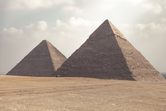 Two pyramids of Gyza during a sunny morning in Cairo.