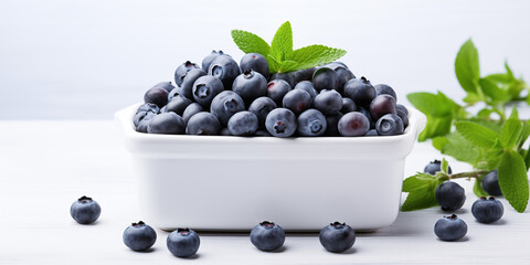 Bowl of plump blueberries crowned with a sprig of mint, a refreshing treat on a light backdrop. Nature vegan lifestyle, fresh berry. Isolated photo. Healthy vegetarian lifestyle, vitamin organic food