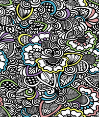 A black and white drawing of flowers painted in bright colors drawn by hand.Seamless pattern.
