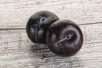 Two ripe sweet black plums