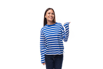 smart young stylish woman with straight hair dressed in a striped sweater