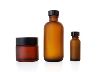 Amber glass bottles for cosmetics, natural medicine or essential oils isolated on a white background
