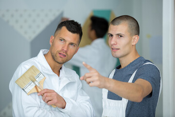 two men working as painters