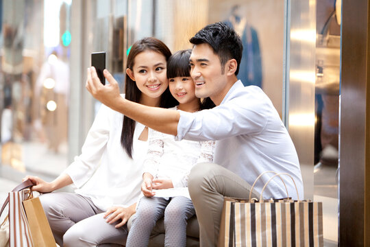 Young family doing self portrait photography in Hong Kong