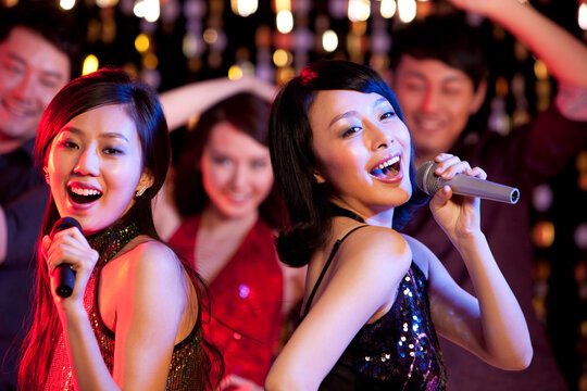 Young people singing Karaoke