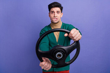 Fototapeta na wymiar Photo of stressed depressed man wear trendy green clothes hold steering wheel new car road traffic jam isolated on purple color background