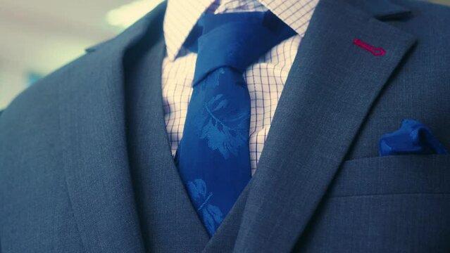 4K Cinematic fashion clothing footage of suits and ties in a tailor's shop